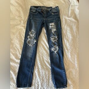 Distressed dark wash skinny jeans